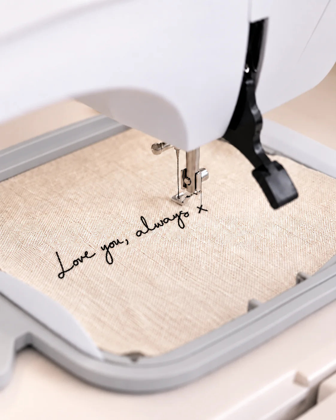 An embroidery machine stitching handwriting
